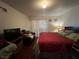 Well-lit bedroom featuring a queen-size bed and a sliding glass door at 4555 E Sahara Ave # 166, Las Vegas, NV 89104