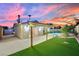 Backyard featuring covered patio, artificial turf, landscaping and block wall. Ideal for outdoor enjoyment and privacy at 4623 Kearney St, Las Vegas, NV 89147