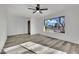 Bedroom featuring modern ceiling fan, gray flooring, new paint and a bright window at 4623 Kearney St, Las Vegas, NV 89147