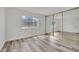 Bright bedroom featuring a full mirrored closet door and a large window at 4623 Kearney St, Las Vegas, NV 89147