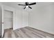 Bedroom with ceiling fan, luxury vinyl plank, and ample closet space at 4623 Kearney St, Las Vegas, NV 89147