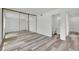 Bright bedroom featuring a full mirrored closet door and an attached, updated bathroom at 4623 Kearney St, Las Vegas, NV 89147