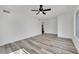 Spacious bedroom with ceiling fan, closet, and luxury vinyl plank flooring at 4623 Kearney St, Las Vegas, NV 89147