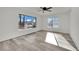 Bedroom featuring luxury vinyl plank flooring and an abundance of natural light at 4623 Kearney St, Las Vegas, NV 89147