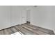 Bright bedroom features wood-look floors, closet, and modern white walls at 4623 Kearney St, Las Vegas, NV 89147