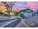 Charming single story home with a two car garage, mature landscaping, and an inviting stone-lined walkway at 4623 Kearney St, Las Vegas, NV 89147