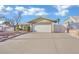 Single story home featuring a two-car garage and well-kept landscaping at 4623 Kearney St, Las Vegas, NV 89147