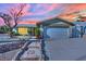 Charming single story home with a two car garage, mature landscaping, and an inviting stone-lined walkway at 4623 Kearney St, Las Vegas, NV 89147
