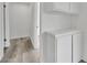 Hallway featuring luxury vinyl plank flooring and custom storage solutions at 4623 Kearney St, Las Vegas, NV 89147