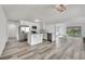 Contemporary kitchen with stainless appliances, center island, and light gray wood-look flooring at 4623 Kearney St, Las Vegas, NV 89147