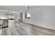 Bright living room features new gray flooring, a brick fireplace, and a view of the backyard at 4623 Kearney St, Las Vegas, NV 89147