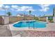 Refreshing backyard pool and spa with desert landscaping and block wall fencing at 4623 Kearney St, Las Vegas, NV 89147