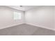 Bright bedroom with gray carpet, a window with blinds, and recessed lighting at 4774 San Sebastian Ave, Las Vegas, NV 89121