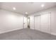 Bedroom featuring gray carpet and a closet with sliding doors and an open doorway at 4774 San Sebastian Ave, Las Vegas, NV 89121