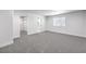 Bedroom with grey carpeting and access to a large walk-in closet at 4774 San Sebastian Ave, Las Vegas, NV 89121