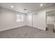 Bedroom featuring gray carpet and a closet with sliding doors and an open doorway at 4774 San Sebastian Ave, Las Vegas, NV 89121