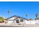 Charming single-story home featuring a two-car garage, palm trees, desert landscaping, and a white stucco facade at 4774 San Sebastian Ave, Las Vegas, NV 89121