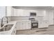 Kitchen showcases modern stainless appliances, white cabinetry, and marble countertops at 4774 San Sebastian Ave, Las Vegas, NV 89121