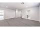 Carpeted living room provides entry to bathroom, bedroom, and outdoor access at 4774 San Sebastian Ave, Las Vegas, NV 89121