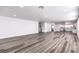 Spacious living room boasts updated flooring, recessed lighting, and an open layout to the kitchen and dining area at 4774 San Sebastian Ave, Las Vegas, NV 89121