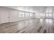 Spacious living room boasts updated flooring, recessed lighting, and ample natural light streaming through large windows at 4774 San Sebastian Ave, Las Vegas, NV 89121