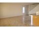 Spacious living room with tile floors, natural light, and adjacent kitchen at 5248 Greene Ln # B, Las Vegas, NV 89119