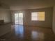 Open-concept living room with sliding glass doors and tiled flooring at 5248 Greene Ln # B, Las Vegas, NV 89119