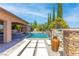 Serene backyard featuring a swimming pool, spa, outdoor seating, and landscape at 5410 Serenity Brook Dr, Las Vegas, NV 89149