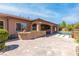 An inviting outdoor space features a covered patio, bar, sparkling pool, and tasteful landscaping, creating a perfect relaxation spot at 5410 Serenity Brook Dr, Las Vegas, NV 89149