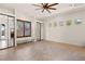 Elegant bedroom with ample natural light, tile floors, and mirrored closet doors for added convenience at 5410 Serenity Brook Dr, Las Vegas, NV 89149