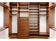 A closet with wood shelving, drawers, and clothing bars for maximum storage at 5410 Serenity Brook Dr, Las Vegas, NV 89149