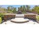 Outdoor fireplace with integrated planters on a custom patio at 5410 Serenity Brook Dr, Las Vegas, NV 89149