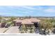 Gorgeous single-story home with a three-car garage, stone accents, and desert landscaping at 5410 Serenity Brook Dr, Las Vegas, NV 89149