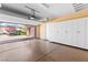 This is a finished two car garage with epoxy floors and storage cabinets at 5410 Serenity Brook Dr, Las Vegas, NV 89149