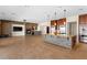 Spacious open kitchen with stone accent island, stainless appliances, and beautiful custom cabinets at 5410 Serenity Brook Dr, Las Vegas, NV 89149
