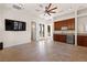 Entertaining space with a wet bar, wine fridge, and TV, plus easy access to the outdoors at 5410 Serenity Brook Dr, Las Vegas, NV 89149