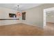 Bright living space with stylish tile flooring, neutral walls, and a wall-mounted TV for entertainment at 5410 Serenity Brook Dr, Las Vegas, NV 89149