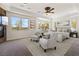 Serene main bedroom with a fireplace, large windows and ample natural light at 5410 Serenity Brook Dr, Las Vegas, NV 89149