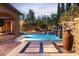 Beautiful pool with water features, and comfortable seating areas, great for outdoor relaxation at 5410 Serenity Brook Dr, Las Vegas, NV 89149