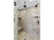 This is a shower with rainfall shower head and built in bench and nook at 5410 Serenity Brook Dr, Las Vegas, NV 89149
