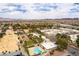 An aerial view of this home shows pool access and lush green landscaping at 555 Rene Ln, Henderson, NV 89015