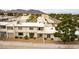 An aerial shot of this home showcases mountain views and mature landscaping at 555 Rene Ln, Henderson, NV 89015