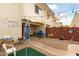 Relaxing back yard with a gravel patio, fence, and an open sky view at 555 Rene Ln, Henderson, NV 89015
