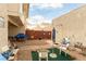 Cozy back yard featuring a gravel patio, comfortable seating, and a secure fence at 555 Rene Ln, Henderson, NV 89015