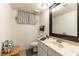 Well-lit bathroom featuring a vanity with sink and a shower/tub with curtain at 555 Rene Ln, Henderson, NV 89015