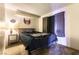 Cozy bedroom with a bed, side table, and decorative wall art at 555 Rene Ln, Henderson, NV 89015