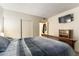 This bedroom boasts a closet, a flat screen TV, and neutral walls at 555 Rene Ln, Henderson, NV 89015