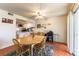 Bright dining area with tile floors and sliding glass doors to the back yard at 555 Rene Ln, Henderson, NV 89015