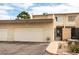 Attached garage and gated front porch area of this charming townhome at 555 Rene Ln, Henderson, NV 89015