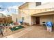 Charming front yard featuring gravel landscaping, patio seating, and string lights at 555 Rene Ln, Henderson, NV 89015